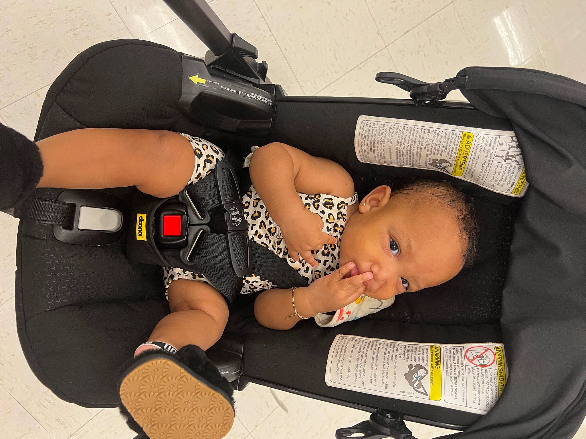 Kind is registered to the contest to win money with this photo: auto_part, automotive_design, automotive_exterior, automotive_tire, automotive_wheel_system, baby, baby_products, baby_toddler_clothing, ballistic_vest, comfort, elbow, headgear, knee, motor_vehicle, person, personal_protective_equipment, sports_gear, thigh, tire, toddler