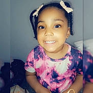 Kenya Conrad joined the competition — help win amazing prizes! background, blurry_edges, braids, casual, child, colorful_clothing, cute, face, fashion, hair_clips, hands, happy, indoor, love_text, person, portrait, smiling, text_overlay, tie_dye_shirt, young_child