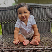 Noah joined the competition — help win amazing prizes! baby, child, smiling, tongue_out, sitting, wicker_bench, outdoor, grass, white_shirt, cute, portrait, happy, infant, person, funny_face, short_hair, natural_light, skin, expression, casual_clothing