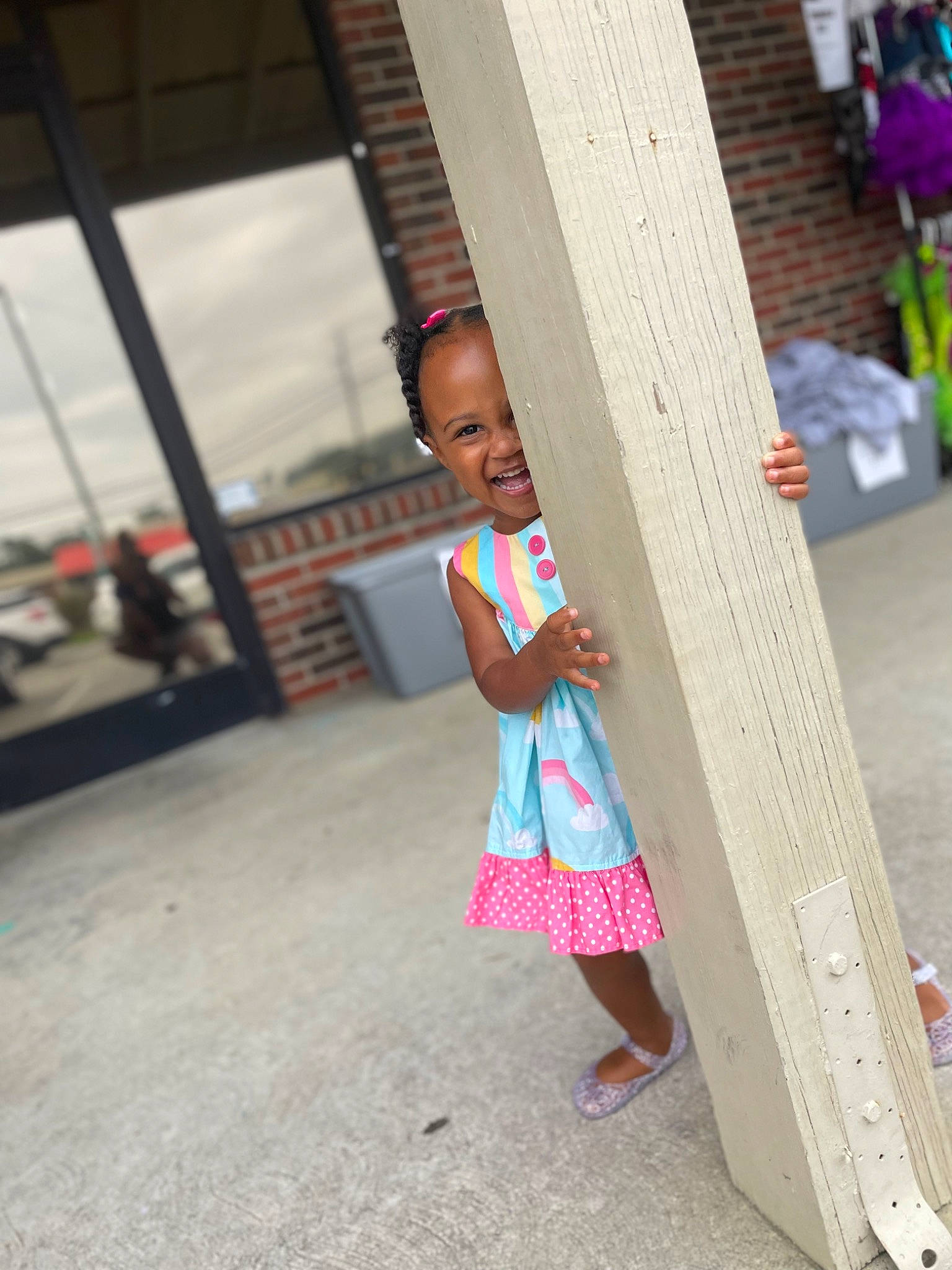 Ava is registered to the contest to win money with this photo: child, city, fun, hairstyle, happy, leisure, magenta, pattern, person, pink, play, road, sandal, skin, smile, street, toddler, tourism, tree, vacation