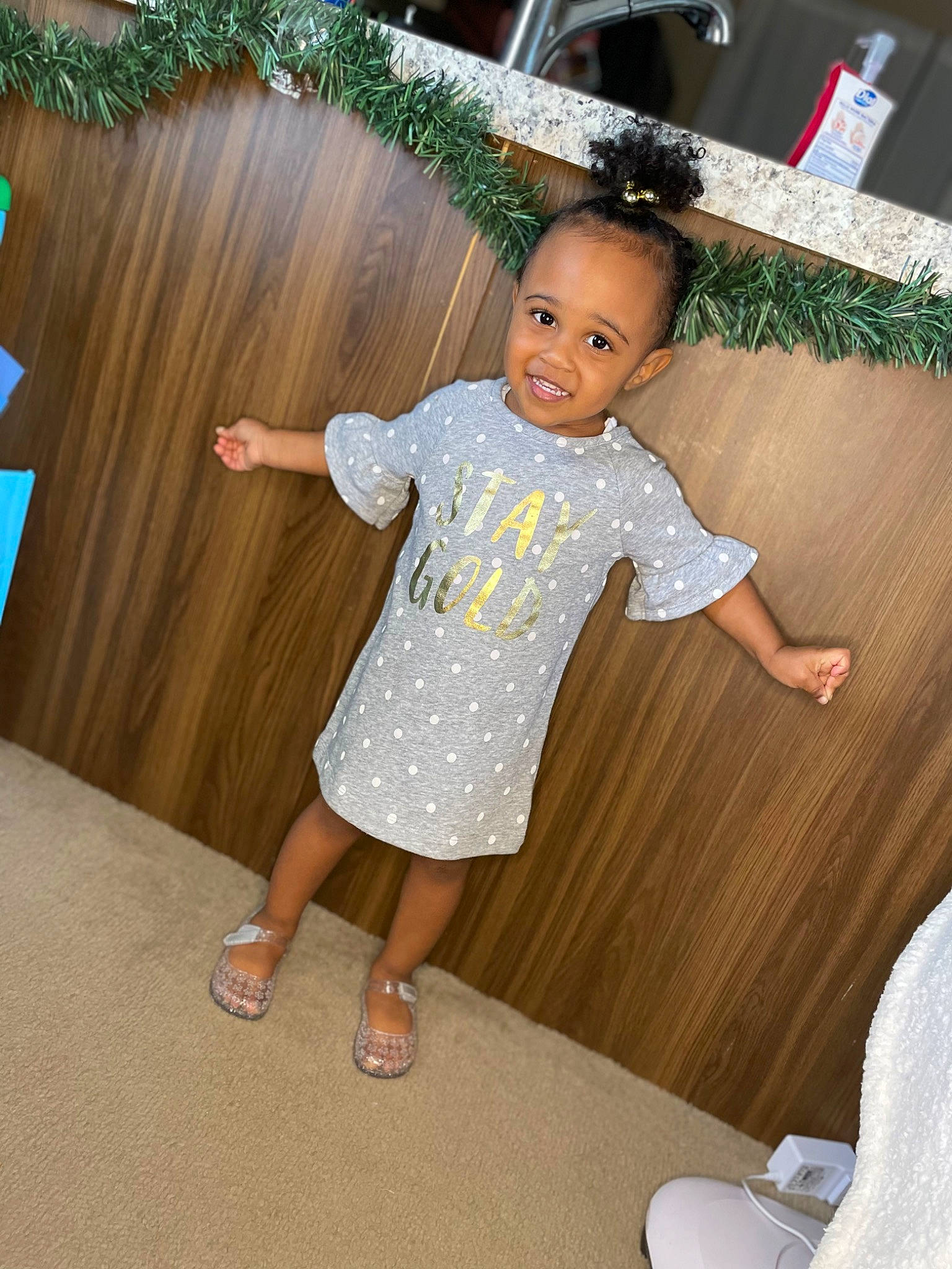 Ava joined the competition — help win amazing prizes! baby_toddler_clothing, child, curtain, facial_expression, finger, flooring, fun, grass, happy, human_leg, joy, leisure, pattern, person, skin, sleeve, smile, standing, t_shirt, textile