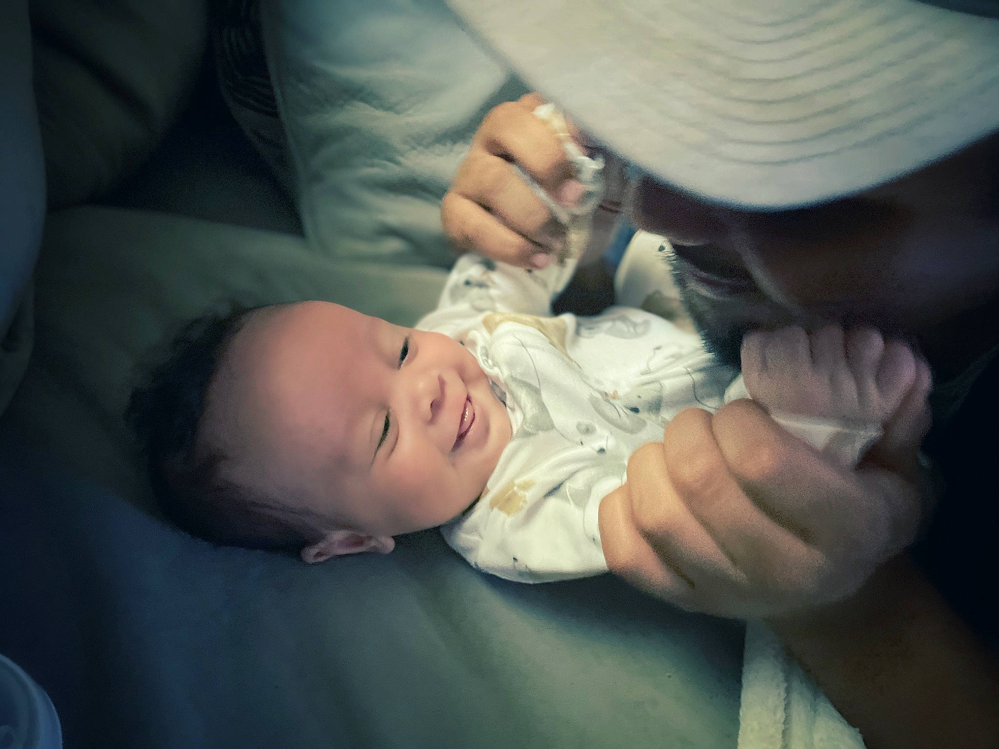 August joined the competition — help win amazing prizes! arm, baby, cheek, child, comfort, elbow, finger, flash_photography, gesture, grass, hand, hat, human_body, mouth, person, plant, sitting, skin, thumb, toddler