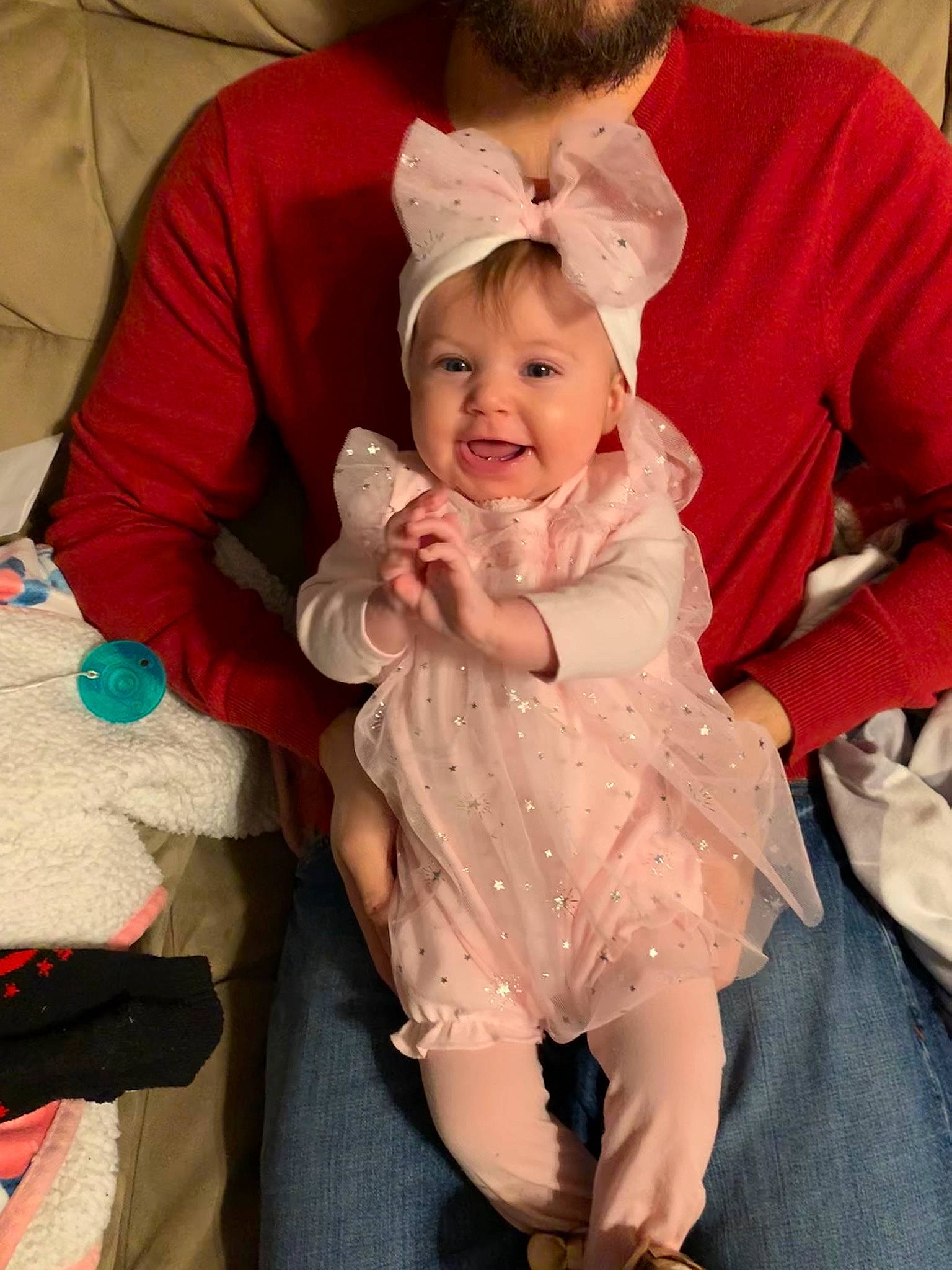 Aislynn is registered to the contest to win money with this photo: baby, cheek, child, joy, outerwear, person, pink, sitting, skin, smile, toddler