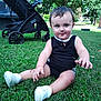 Ace joined the competition — help win amazing prizes! baby, black_clothing, child, cute, daytime, grass, greenery, happy, nature, outdoor, park, person, playful, sitting, smiling, stroller, sunlight, toddler, trees, white_shoes