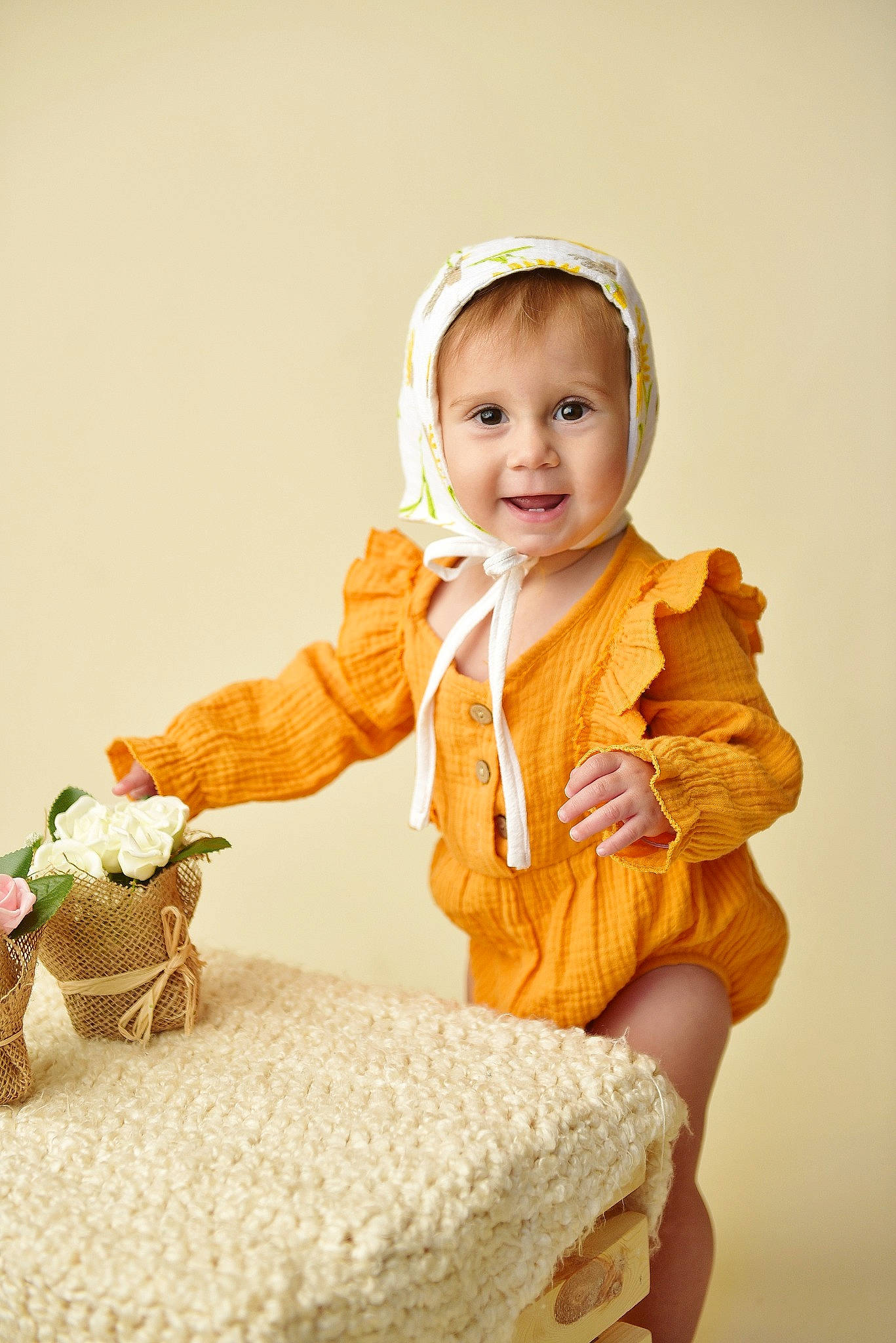 Eowyn joined the competition — help win amazing prizes! baby, child, child_model, ear, happy, headgear, outerwear, person, play, sitting, skin, smile, toddler, yellow