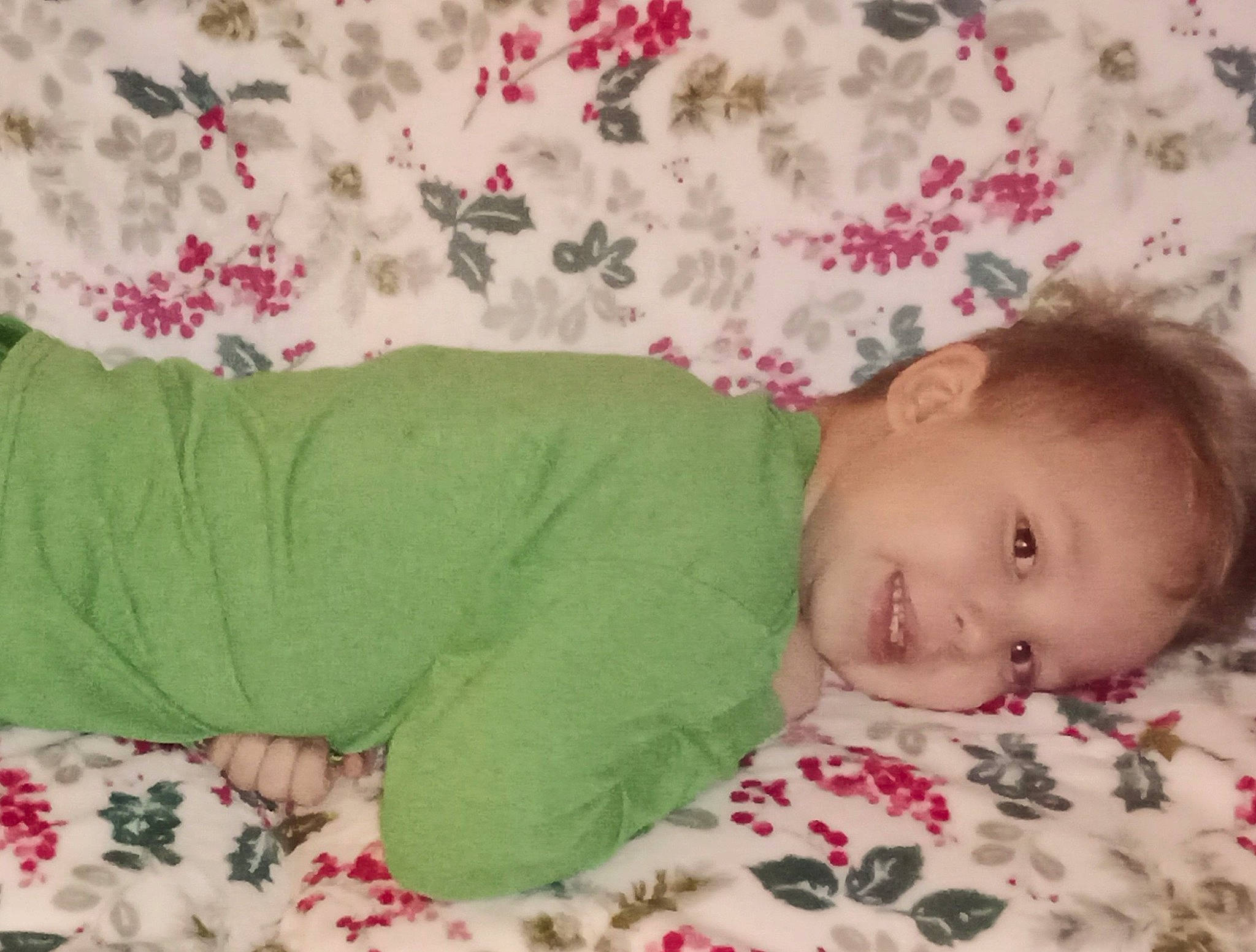 Isaiah is registered to the contest to win money with this photo: baby, baby_products, baby_toddler_clothing, bed, bedding, bedtime, cheek, child, comfort, grass, joy, linens, pattern, person, pink, room, skin, sleeve, smile, textile
