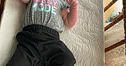Nala is registered to the contest to win money with this photo: baby, infant, crib, headband, shoes, baby_wipes, quilted_mattress, wooden_crib, thumb_sucking, clothing, pants, tshirt, indoor, natural_light, curtains, lace, floor, baby_accessories, sleeping_area, cute