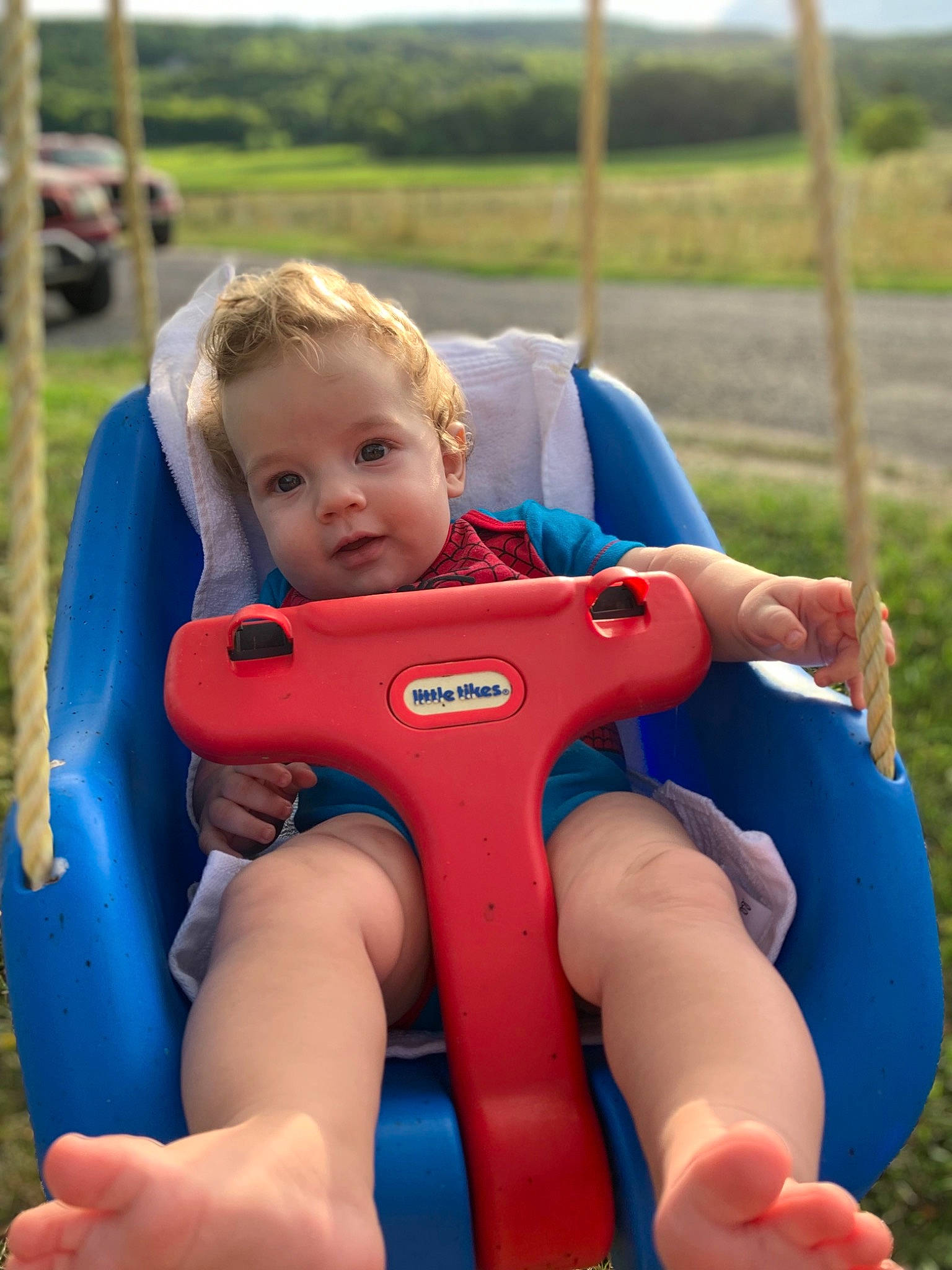 Madden joined the competition — help win amazing prizes! baby, baby_products, baby_toddler_clothing, child, comfort, electric_blue, finger, fun, grass, happy, leisure, person, photograph, plant, recreation, shorts, sitting, sky, thigh, toddler