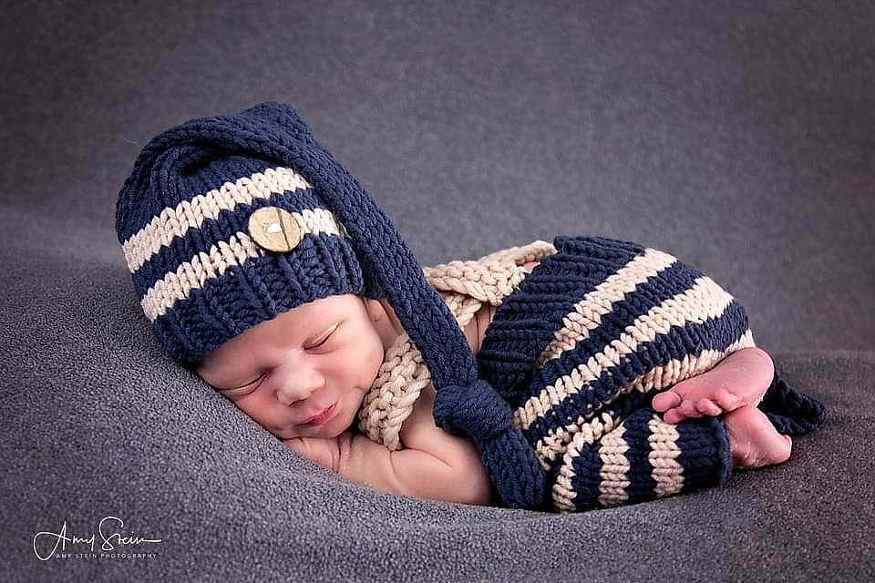 Kingston is registered to the contest to win money with this photo: baby, baby_sleeping, baby_toddler_clothing, beanie, bonnet, child, comfort, costume_accessory, craft, creative_arts, crochet, headgear, headwear, knit_cap, knitting, person, portrait_photography, textile, thread, wool