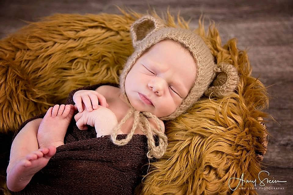Kingston is registered to the contest to win money with this photo: animal_product, baby_toddler_clothing, beauty, blond, brown, brown_hair, cheek, child, comfort, fawn, fur, fur_clothing, human, nail, natural_material, nose, person, skin, textile, winter