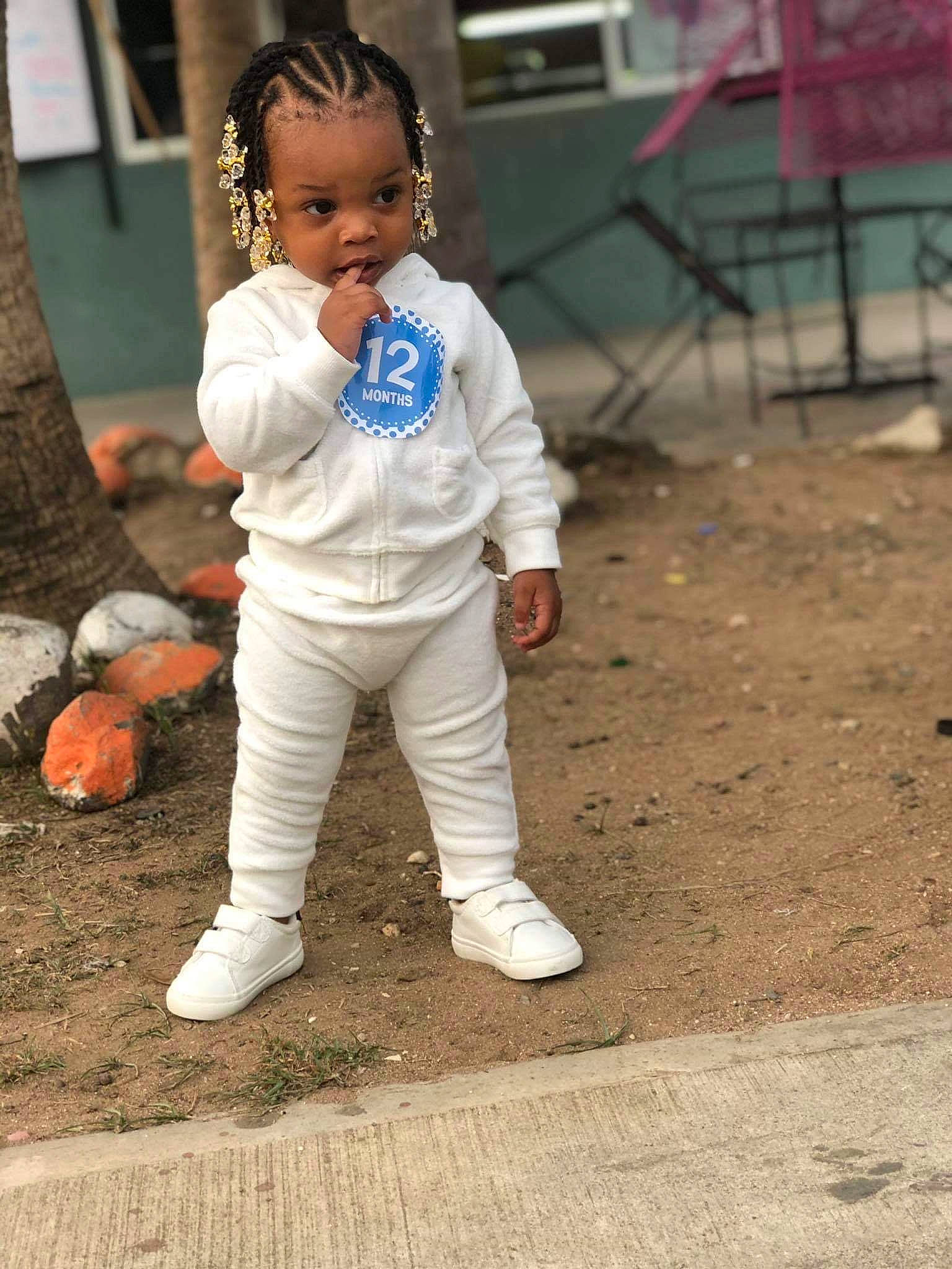 Kendra joined the competition — help win amazing prizes! ball, child, competition_event, eye, fun, grass, hair, hairstyle, hand, happy, head, leg, leisure, person, player, recreation, sitting, soil, street_fashion, toddler