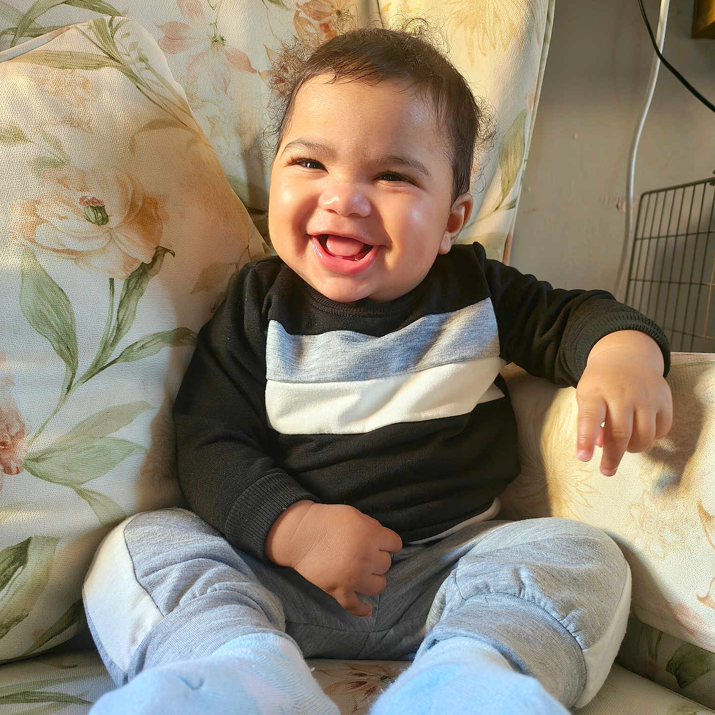 Jeremiah-Jirah is registered to the contest to win money with this photo: baby, babylaughing, bodypart, clothing, couch, cushion, face, furniture, happy, head, homedecor, hosiery, laughing, pants, person, photography, portrait, sitting, smile, sock