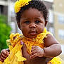 baby, child, yellow_dress, headband, butterflies, close_up, outdoor, holding_hand, curious_look, portrait, cute, skin, face, eyes, person, hand, nails, flower, fashion, summer