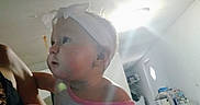 Emery joined the competition — help win amazing prizes! baby, child, indoor, headband, tutu, pink, curious, person, clothing, room, floor, light, toy, furniture, table, chair, face, infant, girl, playroom
