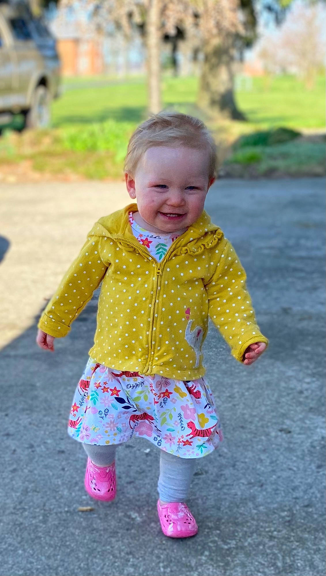 Kaylynn is registered to the contest to win money with this photo: baby, baby_toddler_clothing, child, face, fun, grass, happy, joy, leaf, leisure, pattern, people_in_nature, person, pink, plant, sleeve, smile, standing, summer, t_shirt