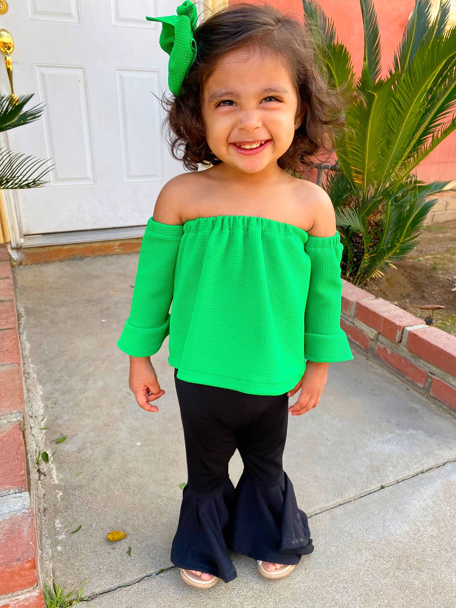 Emmalyn joined the competition — help win amazing prizes! child, child_model, clothing, costume, dress, fashion_accessory, green, joint, joy, neck, pattern, person, ruffle, shoulder, sleeve, smile, toddler, turquoise