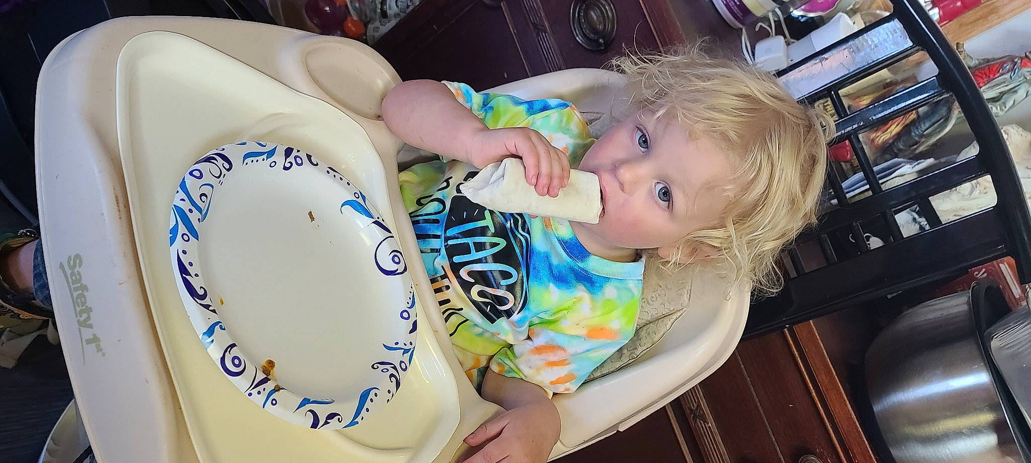 Gunner joined the competition — help win amazing prizes! baby, baby_toddler_clothing, bookcase, chair, cheek, child, dishware, drinkware, facial_expression, food, iris, mammal, person, porcelain, serveware, shelf, shelving, skin, smile, tableware