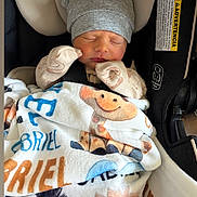 Gabriel joined the competition — help win amazing prizes! newborn, baby, sleeping, car_seat, blanket, hat, gloves, infant, cute, cozy, child, animal_print, toddler, clothing, resting, safety_belt, portrait, indoors, cute_hat, peaceful