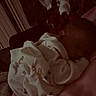 Gabriel is registered to the contest to win money with this photo: baby, sleeping, blanket, bedtime, night, pink, soft, cozy, indoors, child, peaceful, rest, cute, text_overlay, clothing, infant, person, quiet, warm, comfort