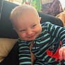 Gabriel joined the competition — help win amazing prizes! baby, blanket, cheeky, child, couch, cute, face, hand, happy, home, indoor, infant, light, onesie, person, playful, smile, striped_clothing, toy, window