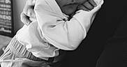 Gabriel is registered to the contest to win money with this photo: baby, newborn, sleeping, black_and_white, hat, clothing, hand, person, portrait, cozy, infant, closeup, love, care, tired, rest, soft, warm, holding, peaceful