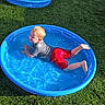 Lucas joined the competition — help win amazing prizes! child, kids, pool, water, splashing, blue_pool, grass, outdoor, play, summer, happy, fun, splash, water_play, boy, clothing, shorts, tshirt, sunlight, daytime