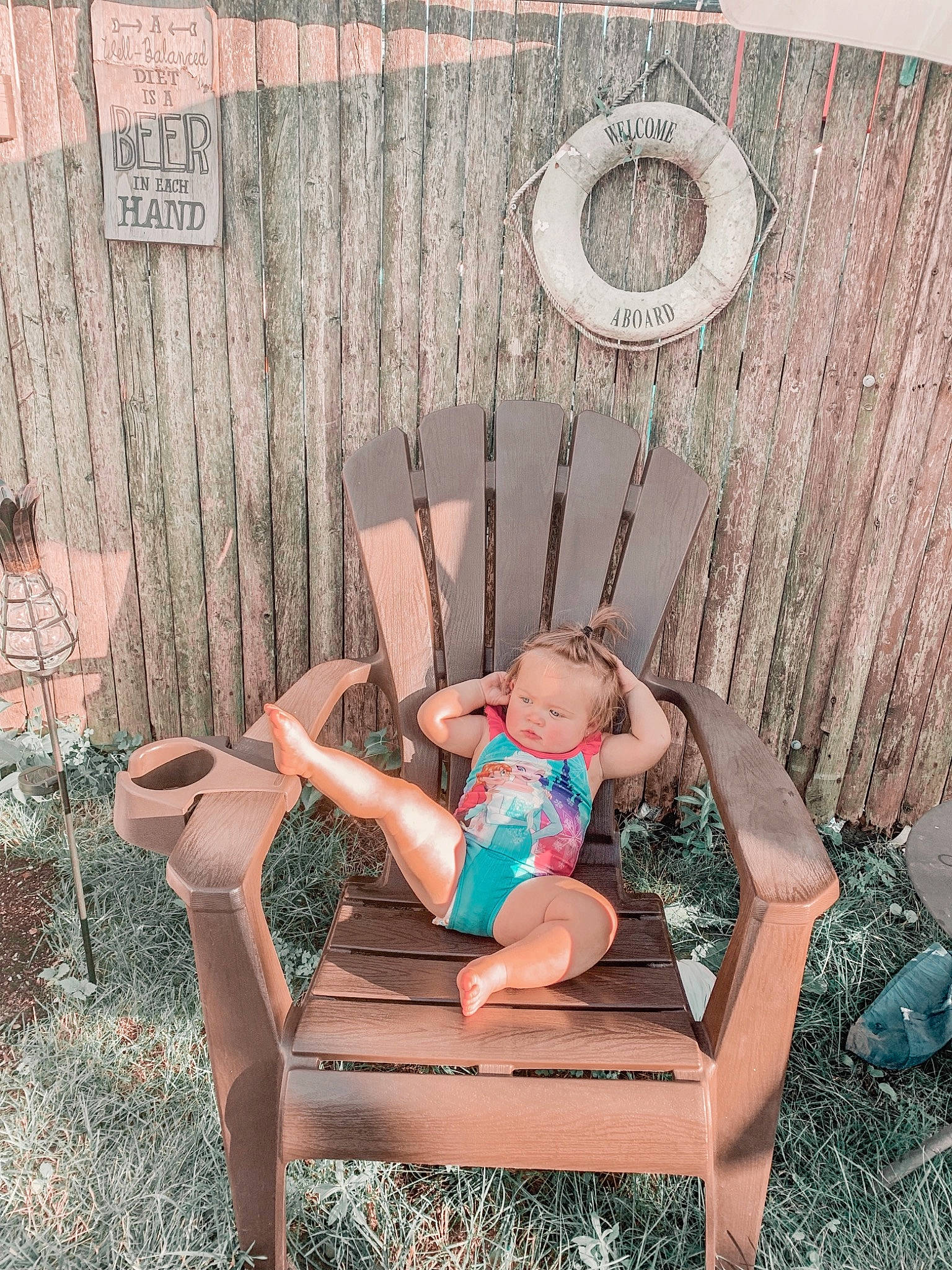 Briar Rose is registered to the contest to win money with this photo: chair, child, furniture, leg, person, pink, plant, sitting, table, toddler, tree
