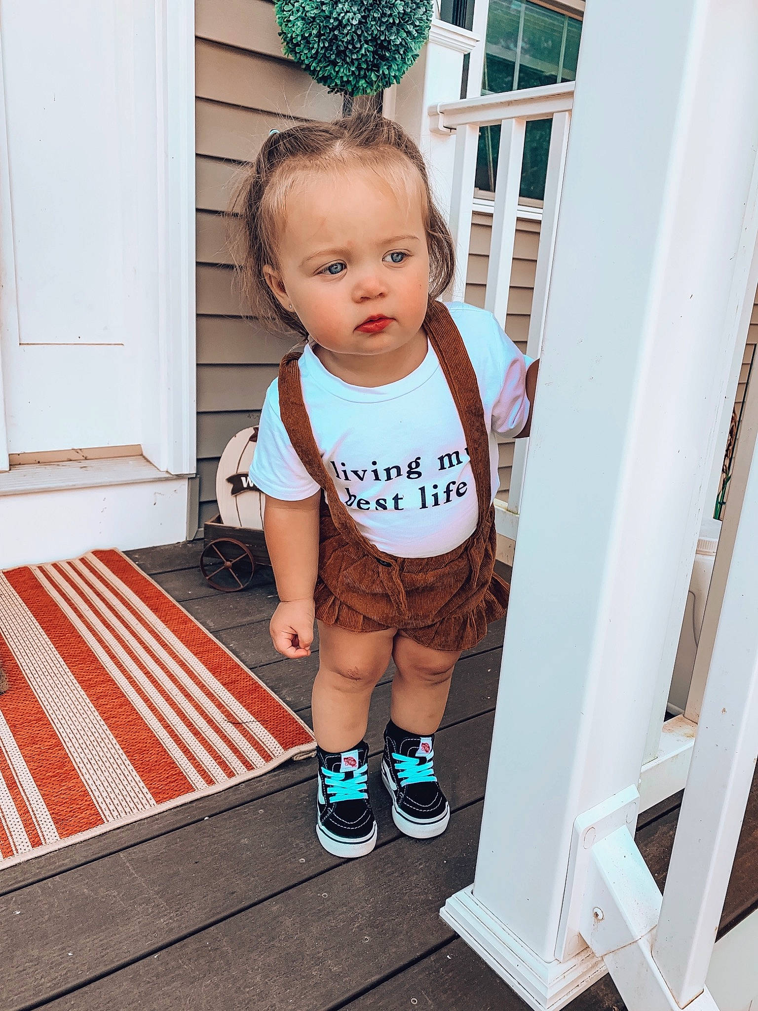 Briar Rose is registered to the contest to win money with this photo: baby, baby_products, baby_toddler_clothing, child, child_model, door, floor, footwear, person, product, room, shoe, standing, t_shirt, toddler