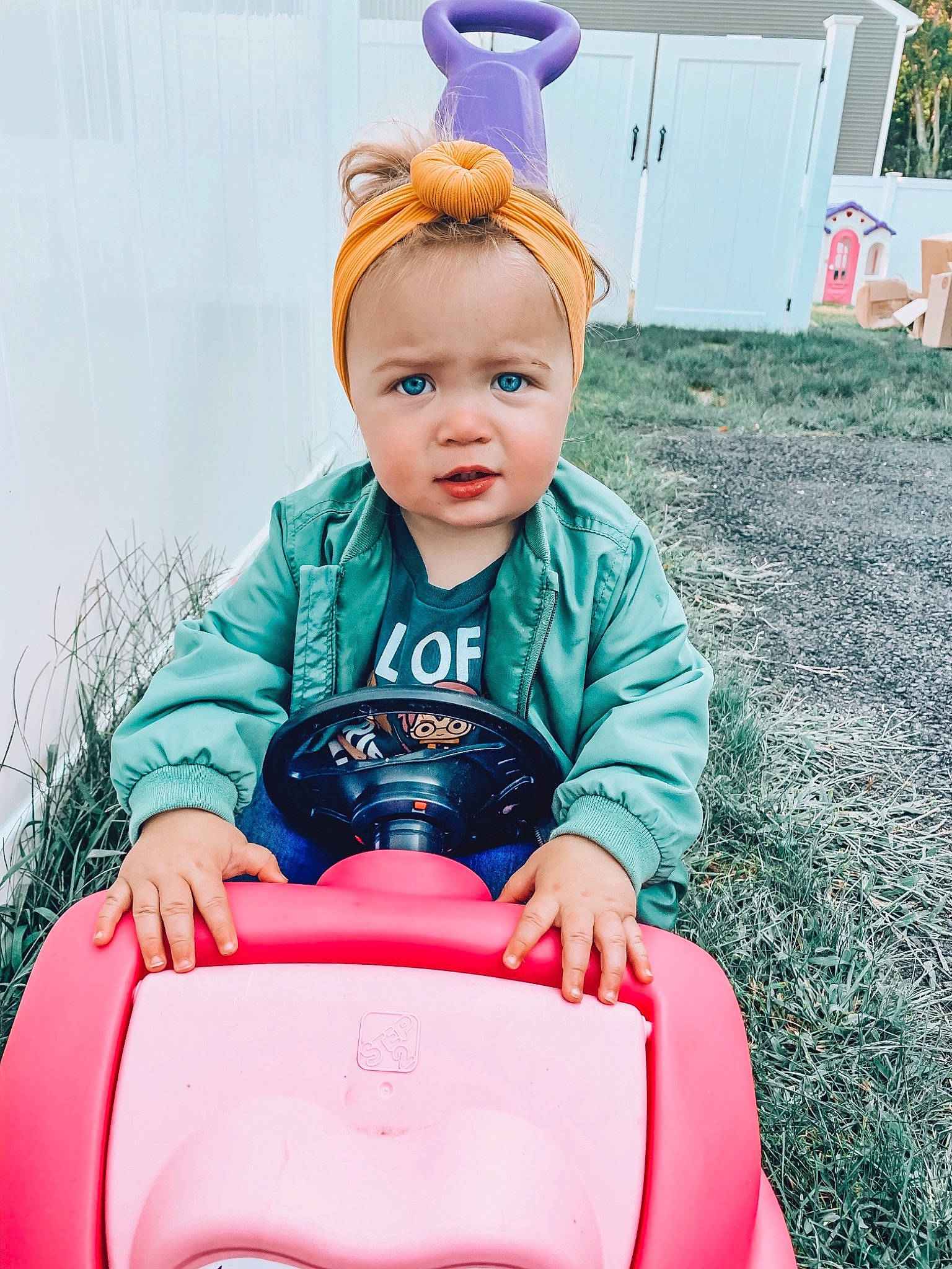 Briar Rose is registered to the contest to win money with this photo: baby, blond, child, ear, fun, happy, person, pink, play, product, sitting, smile, sorrow, toddler, toy, vacation