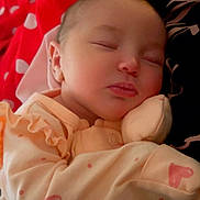 Holly joined the competition — help win amazing prizes! baby, sleeping, onesie, heart_pattern, red_blanket, polka_dots, cozy, peaceful, infant, soft_lighting, face, closed_eyes, cute, resting, portrait, child, newborn, fabric, comfort, cuddly