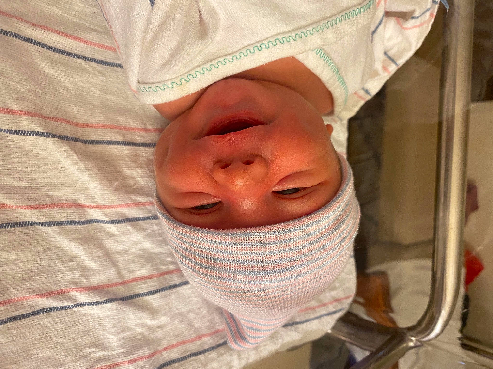 Mark is registered to the contest to win money with this photo: baby, baby_toddler_clothing, cheek, comfort, eye, eyebrow, eyelash, face, finger, happy, headgear, headwear, linens, lip, mouth, nose, person, skin, sleeve, smile