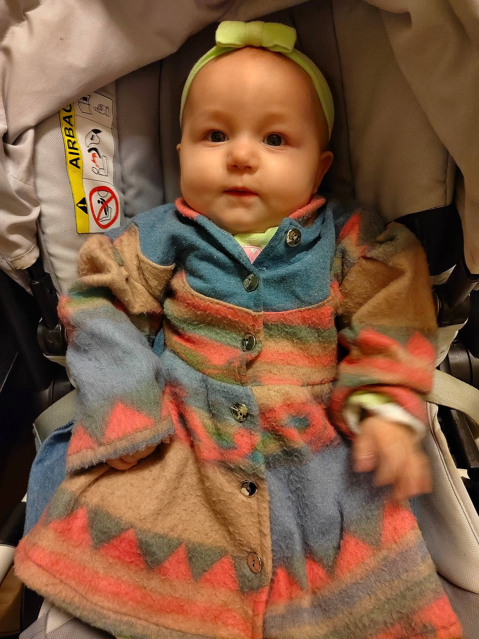 Jena participe au concours pour gagner de l'argent avec cette photo : baby, baby_carriage, baby_products, baby_toddler_clothing, car_seat, child, costume, doll, eye, fashion_accessory, fun, gesture, headgear, jacket, military_camouflage, outerwear, pattern, person, sitting, sleeve