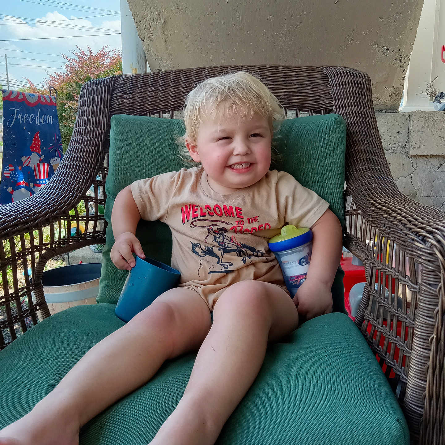 Ryder is registered to the contest to win money with this photo: armchair, bodypart, boy, chair, child, clothing, couch, cup, cushion, disposablecup, face, finger, furniture, hand, head, homedecor, male, person, sitting, t_shirt