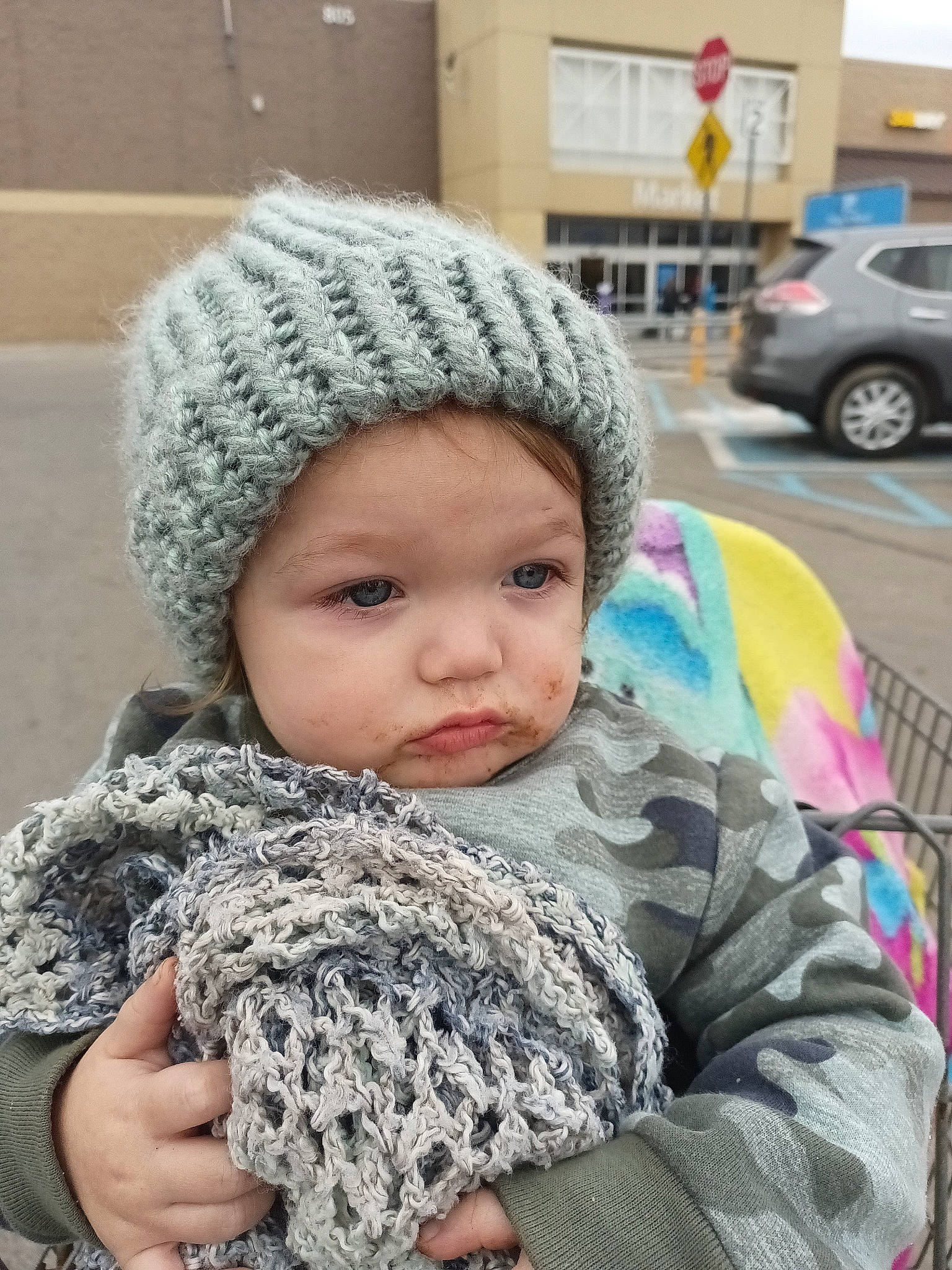 Ashton is registered to the contest to win money with this photo: cap, car, child, family_car, fashion_accessory, freezing, fur, grey, headgear, headwear, knit_cap, pattern, person, photograph, stole, textile, tire, toddler, wheel, winter