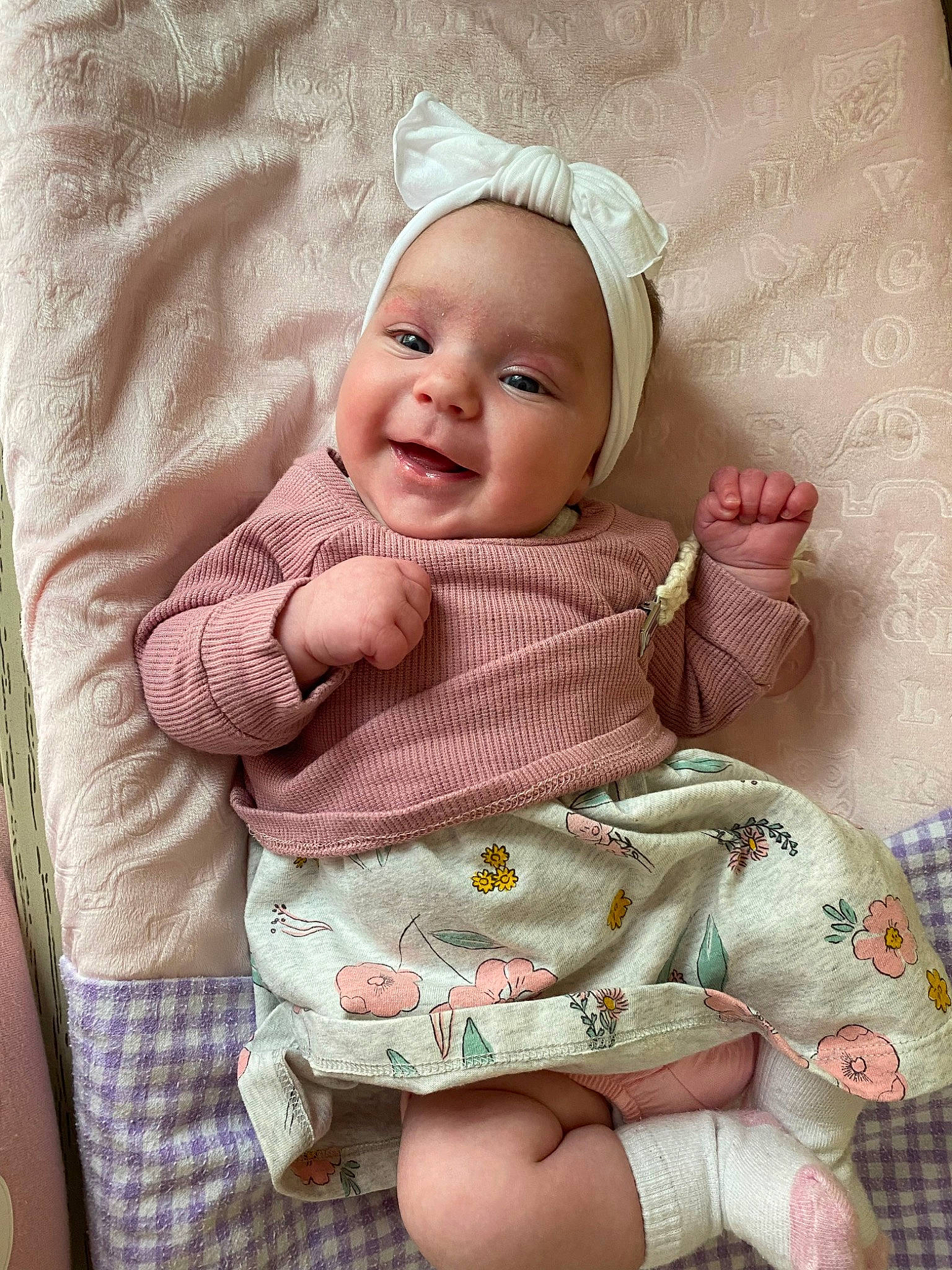 Avery is registered to the contest to win money with this photo: baby, baby_toddler_clothing, cap, cheek, comfort, dress, eye, face, grass, happy, head, headwear, lip, pattern, person, pink, product, skin, sleeve, smile