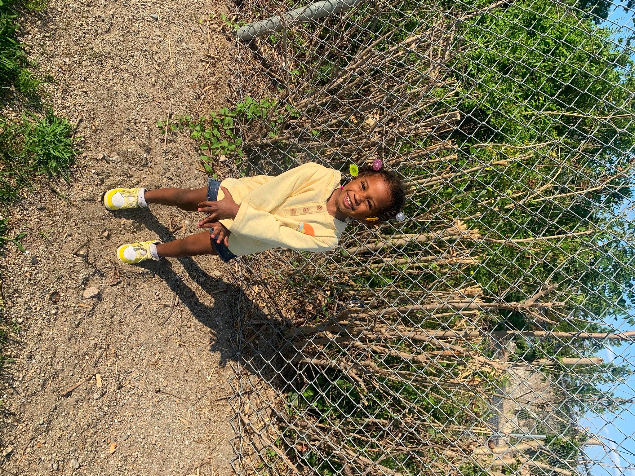 Anyla is registered to the contest to win money with this photo: adaptation, asphalt, child, fun, grass, grass_family, joy, landscape, leisure, organism, people_in_nature, person, plant, shadow, sitting, sky, soil, toddler, tree, trunk