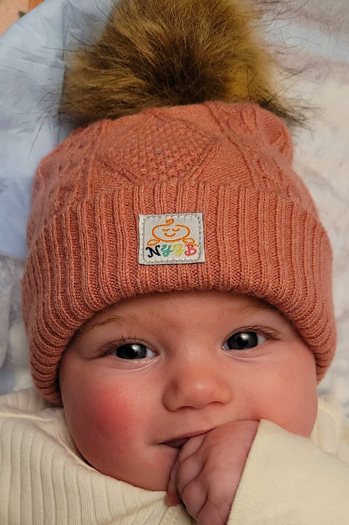 River joined the competition — help win amazing prizes! baby, beanie, cap, cheek, child, chin, close_up, comfort, eye, eyebrow, eyelash, fashion_accessory, headgear, headwear, knit_cap, outerwear, person, photograph, skin, toddler