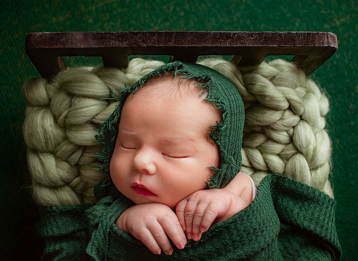 Taytum joined the competition — help win amazing prizes! art, baby, baby_sleeping, baby_toddler_clothing, child, comfort, fashion_accessory, gesture, grass, hand, happy, linens, pattern, person, rectangle, sitting, thumb, toddler, wood, wool