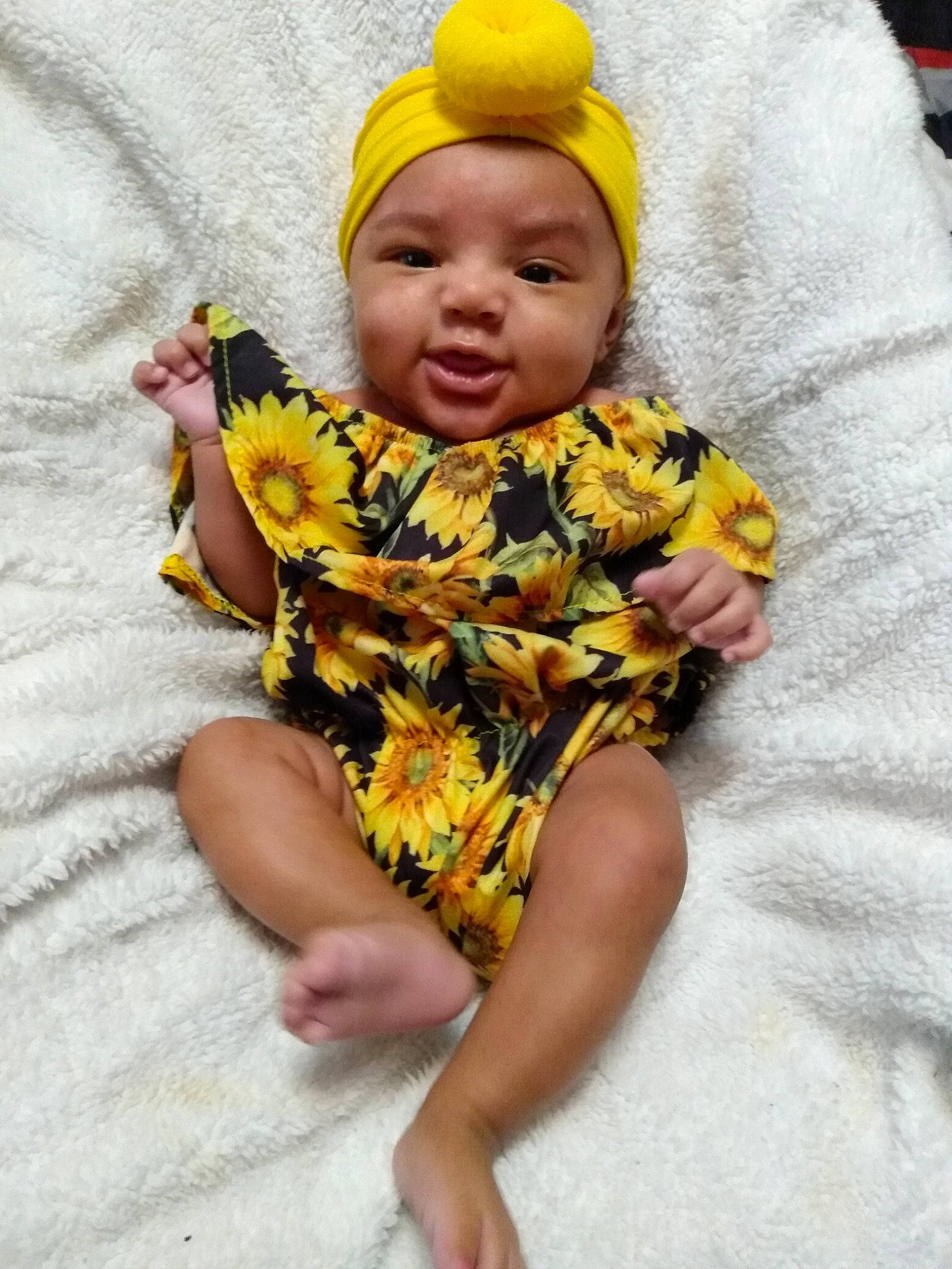 A'Nyla is registered to the contest to win money with this photo: baby, baby_toddler_clothing, cap, chair, cheek, child, comfort, eye, finger, fun, hand, happy, head, headwear, mouth, pattern, person, sitting, skin, sleeve