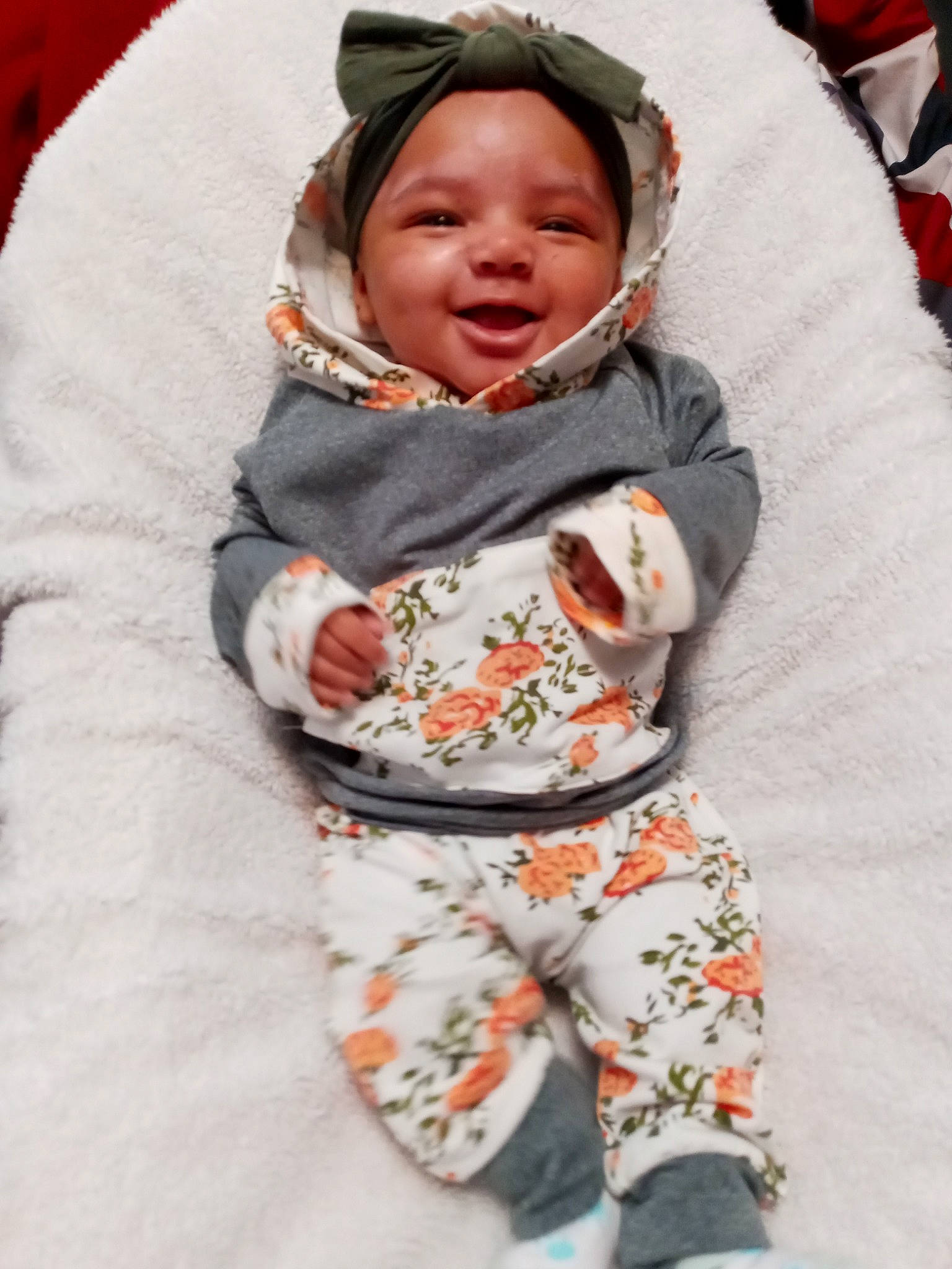 A'Nyla is registered to the contest to win money with this photo: baby, baby_toddler_clothing, child, comfort, face, happy, headwear, linens, pattern, peach, person, sleeve, smile, toddler