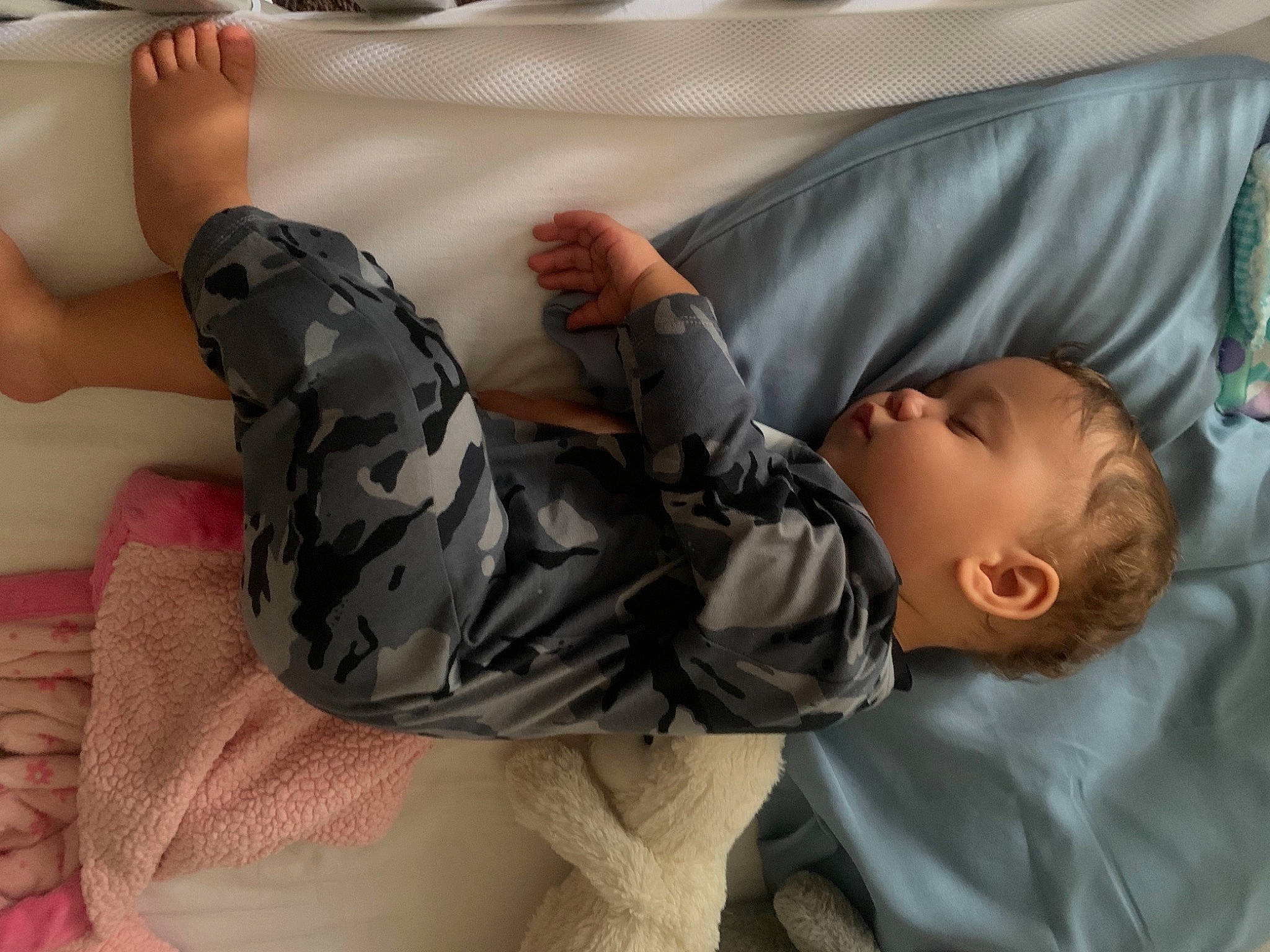 Devaughn is registered to the contest to win money with this photo: baby, baby_products, camouflage, car_seat, child, comfort, elbow, gesture, human_leg, infant_bed, joint, knee, linens, military_camouflage, pattern, person, room, sitting, sleeve, thigh