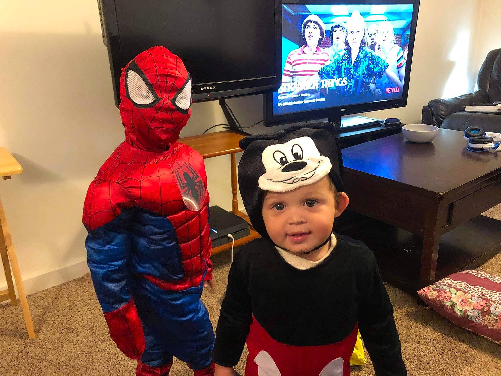 Jaxsyn is registered to the contest to win money with this photo: baseball_cap, cap, display_device, entertainment, event, eyewear, fictional_character, fun, headgear, headwear, led_backlit_lcd_display, leisure, person, personal_protective_equipment, recreation, room, spider_man, t_shirt, table, television