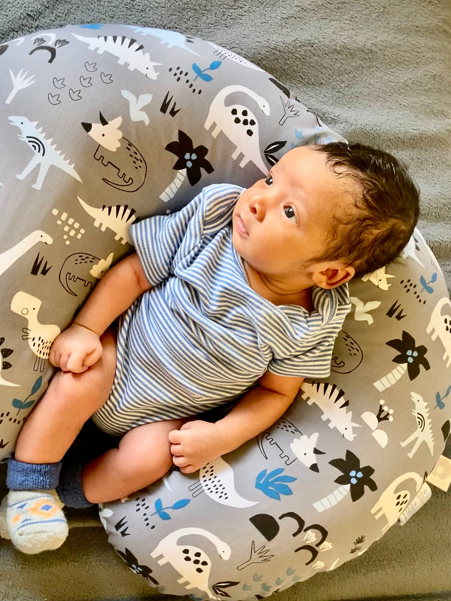 Ezekiel is registered to the contest to win money with this photo: baby, baby_toddler_clothing, child, comfort, cool, facial_expression, fun, hairstyle, happy, leisure, mammal, pattern, people, person, product, shorts, skin, sleeve, textile, toddler