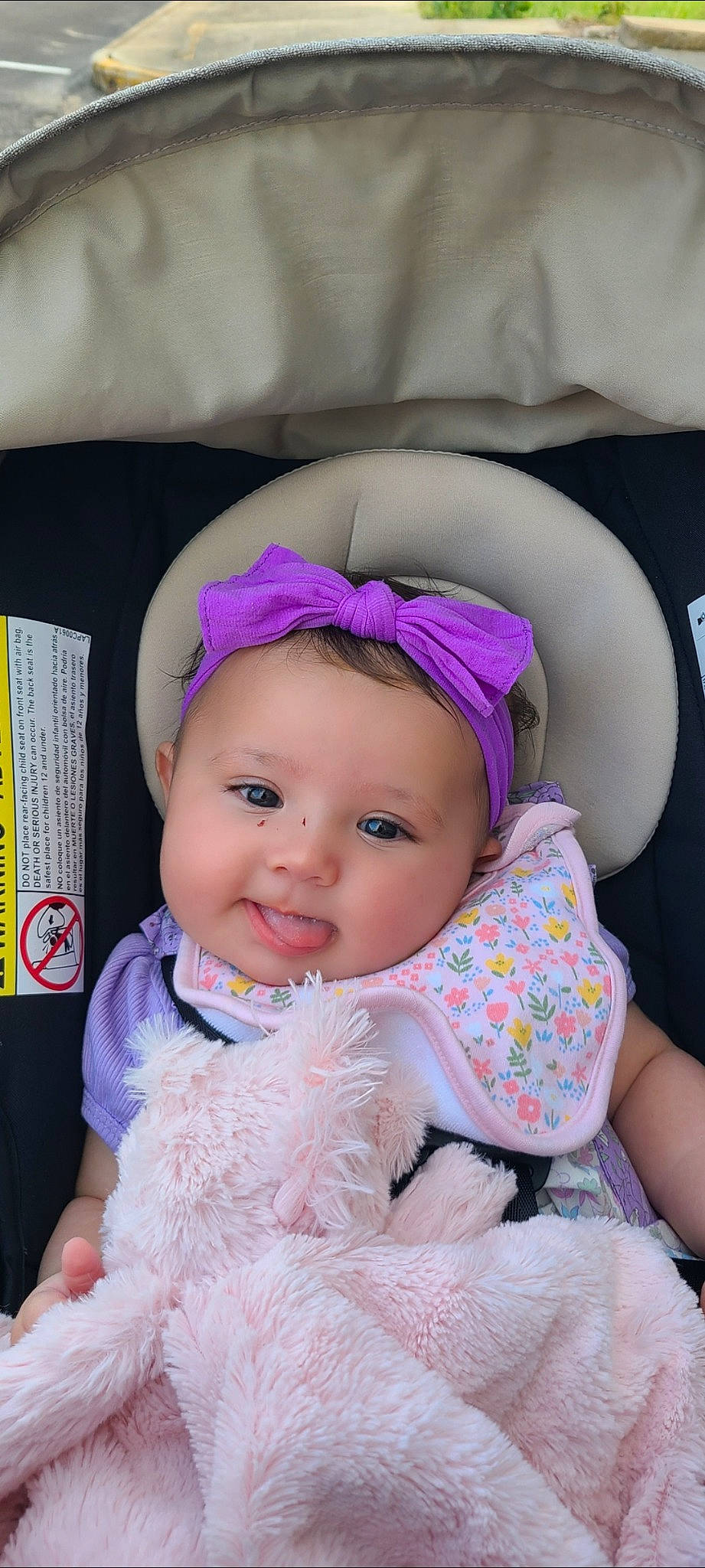 Sophia Eloise is registered to the contest to win money with this photo: baby, baby_products, baby_toddler_clothing, beanie, car_seat, cheek, child, comfort, fashion_accessory, fur, happy, headwear, magenta, person, pink, purple, sitting, sleeve, smile, textile