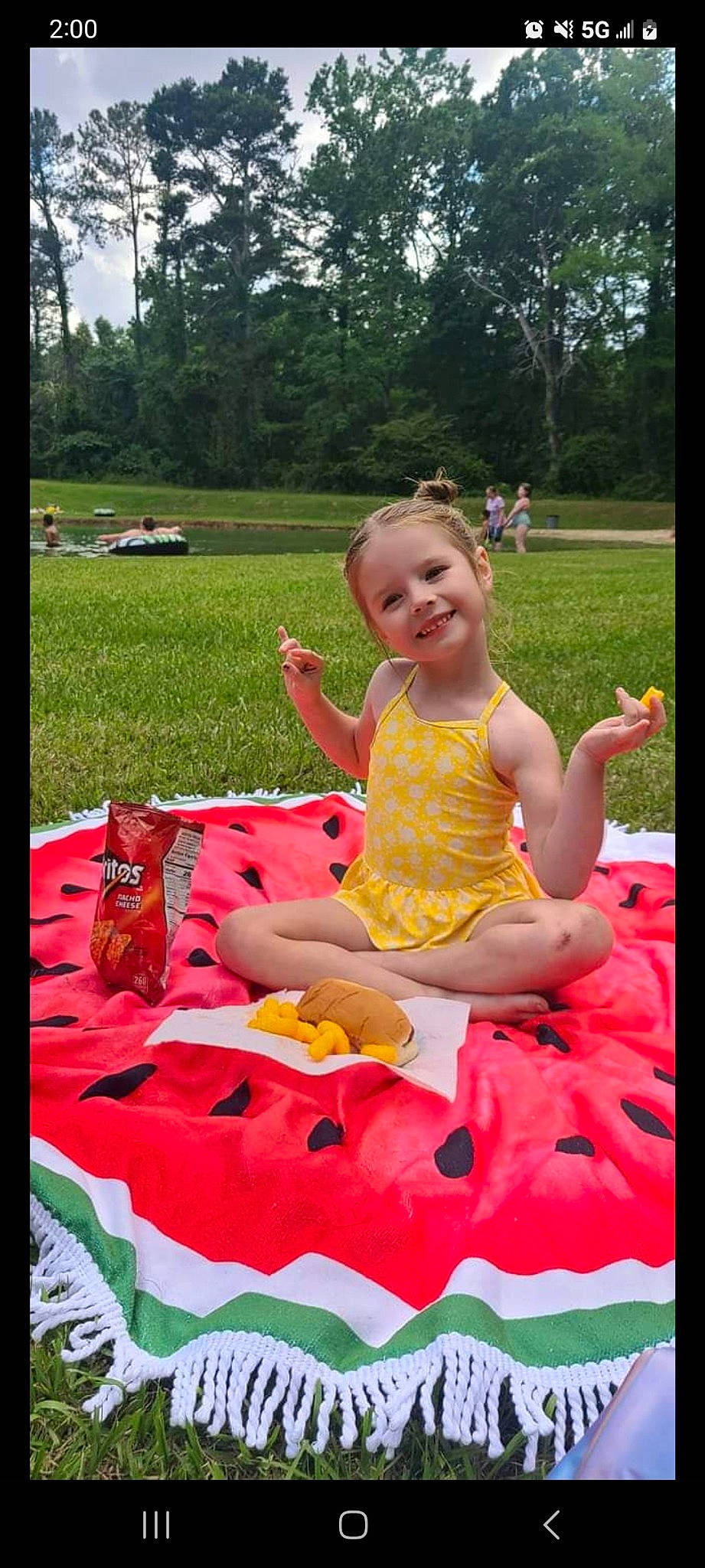 Vivian joined the competition — help win amazing prizes! baby_toddler_clothing, child, event, fun, grass, happy, joy, leisure, magenta, nature, people_in_nature, person, pink, plant, play, recreation, sitting, sky, smile, summer
