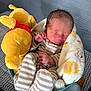 baby, newborn, infant, sleeping, plush_toy, winnie_the_pooh, stuffed_animal, blanket, striped_pajamas, basket, bottle, hand, feet, closeup, portrait, soft_toy, bed, fabric_texture, cozy, nursery