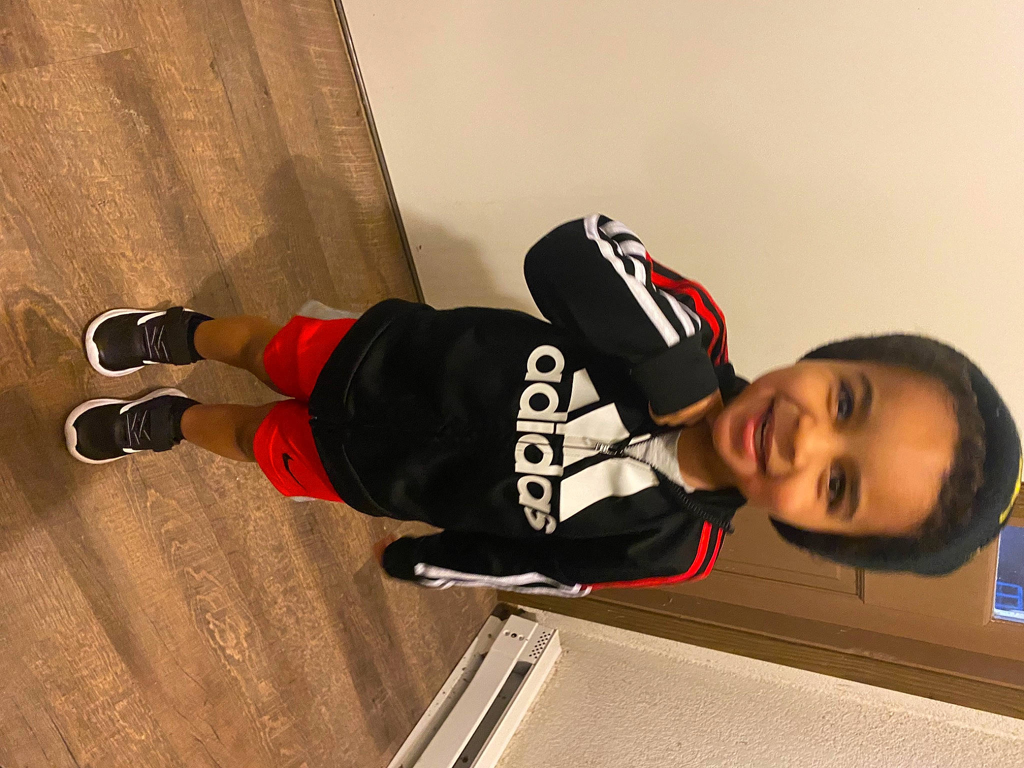 Jabari joined the competition — help win amazing prizes! carmine, child, cool, elbow, flooring, hardwood, human_leg, joy, knee, outdoor_shoe, person, personal_protective_equipment, sleeve, smile, sock, sports_jersey, sportswear, thigh, toddler, varnish