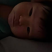 Ian joined the competition — help win amazing prizes! baby, blanket, child, closeup, cuteness, dark, expressionless, face, hair, head, indoors, infant, person, portrait, quiet, resting, skin, sleeping, soft_light, young