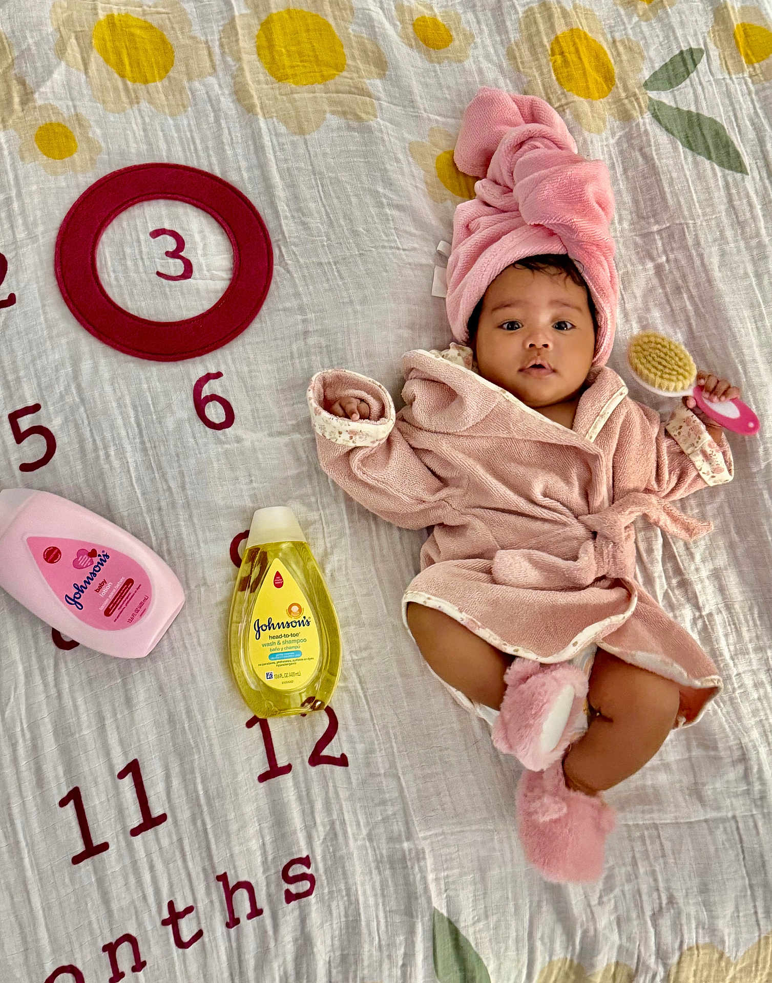 Harper joined the competition — help win amazing prizes! baby, infant, pink_towel, pink_slippers, baby_brush, blanket, numbers, months, baby_bottle, baby_shampoo, baby_lotion, face, cute, lying_down, indoor, child, skin, head_towel, baby_care, soft_toy