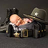 newborn, baby, sleeping, police, boots, sheriff_hat, belt, law_enforcement, portrait, black_background, wrapped, cute, infant, peaceful, props, studio_photo, smiling, headgear, leather, uniform